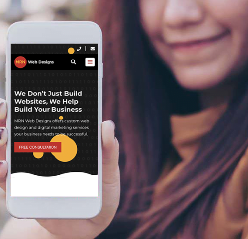 woman holding phone displaying Triniti Marketings website on a mobile phone